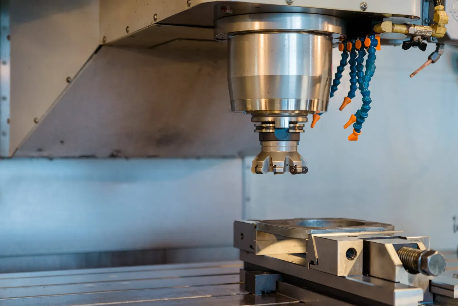 A milling head above a clamped workpiece
